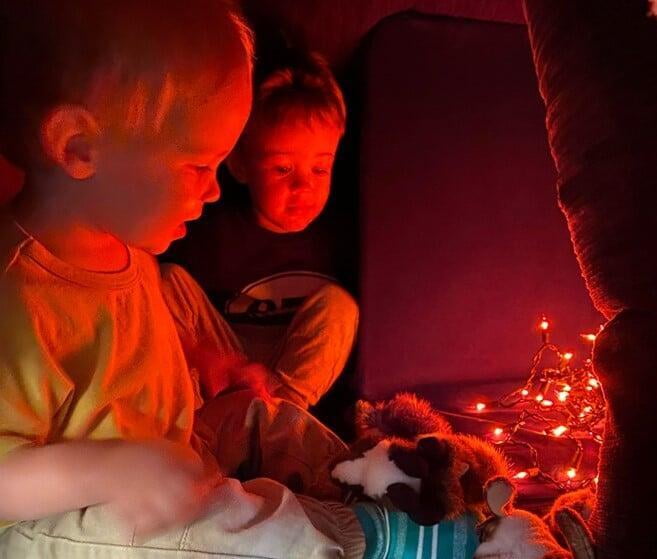 Two children playing in a fort
