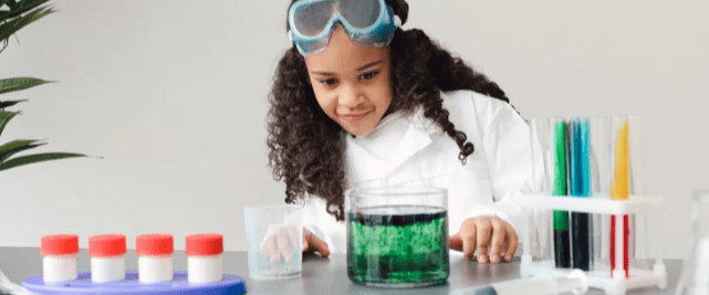 Child performing science experiment